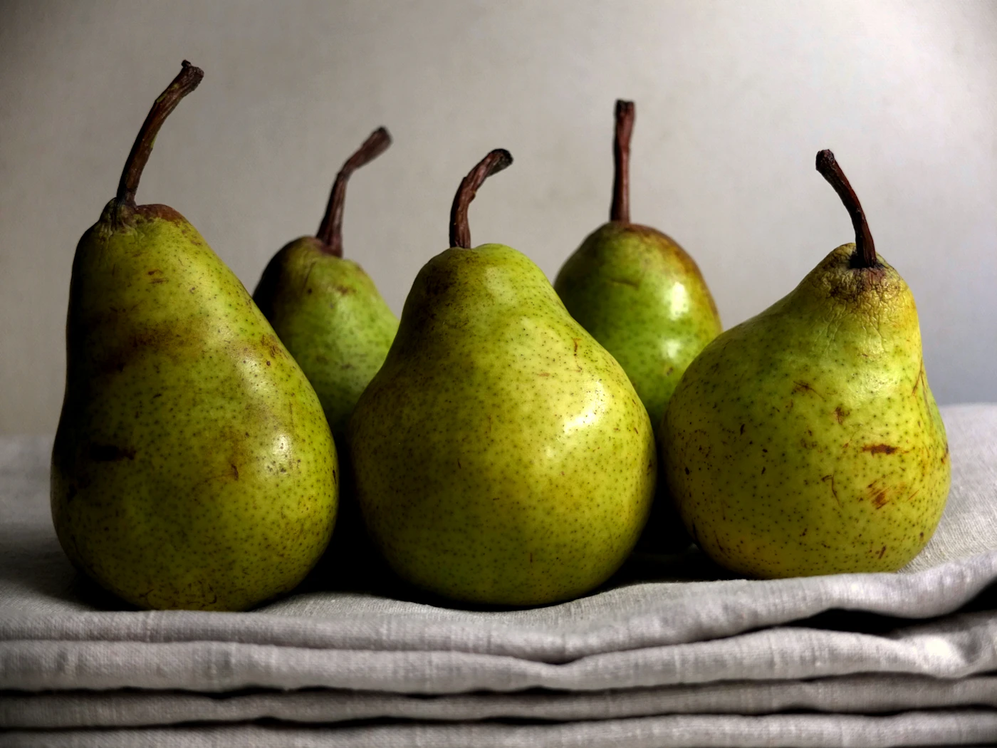 Green pears photographed in natural light.